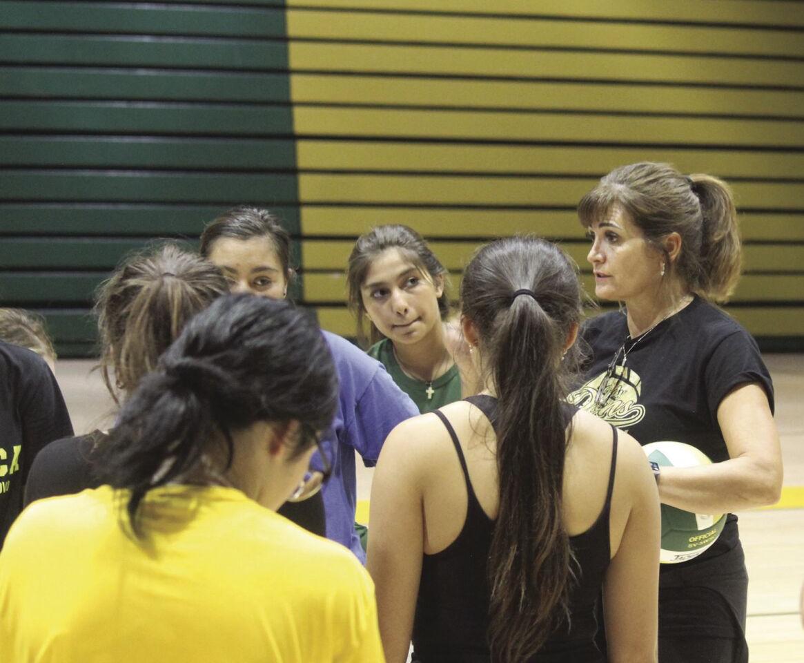 Stacy talks with the team